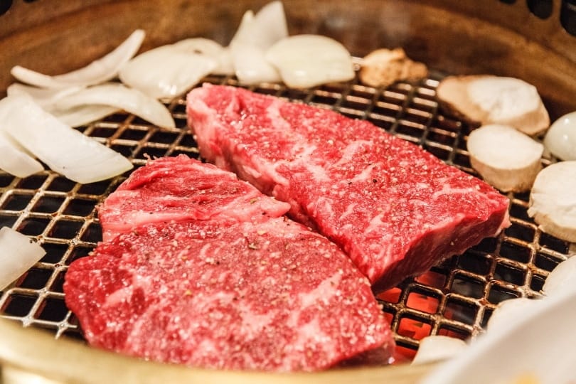 Slices of Wagyu beef on the grill